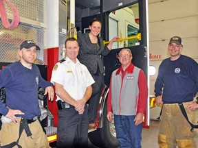 Former Ontario Queen of the Furrow, and West Perth resident Sara Little (center), was mayor for a day last Wednesday, Dec. 18. Little accompanied West Perth Mayor Walter McKenzie and learned the ropes of being a mayor and running a municipality. Part of the day included touring several municipal buildings and departments including the West Perth Fire Hall. Joining Little at the fire hall was, from left, firefighter Jody Catalan, West Perth Fire Prevention Officer Todd McKone, Mayor McKenzie and Capt. Rick Cook. KRISTINE JEAN/MITCHELL ADVOCATE