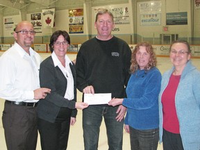 Presenting a cheque for $1,500 to the Mitchell & District Arena is, from left, Mark and Cheryl Moore; co-owners of Tim Hortons; Rick Vivian, facilities manager; Joanne Foster, chair of the Commodity Food Court at the IPM; and Agnes Denham, secretary with the Perth County Federation of Agriculture. KRISTINE JEAN/MITCHELL ADVOCATE