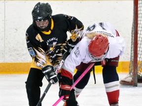 Emily Ruby (61) of the Mitchell U14 Rock ringette team powers her way with the ring away from Woolwich’s Madison Waters during WRRL action in Mitchell Dec. 21. ANDY BADER/MITCHELL ADVOCATE