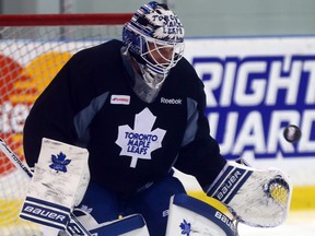James Reimer makes a save during Leafs practice at the Mastercard Centre in Toronto on Sunday, December 22, 2013. (Dave Abel/Toronto Sun)