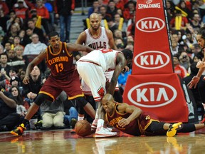 Cavaliers point guard Jarrett Jack (bottom) and Bulls small forward Tony Snell (20) go for a loose ball during second half NBA action earlier this month in Chicago. (David Banks/USA TODAY Sports)