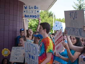 Students from KCVI stand in front of the doors of the Limestone School District Eduation Centere and protest the possible closure of the school. 
Sam Koebrich for The Whig-Standard