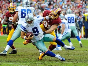 Washington Redskins linebacker Ryan Kerrigan sacks Dallas Cowboys quarterback Tony Romo (9) during the second half at FedEx Field Sunday. (Brad Mills/USA TODAY Sports)