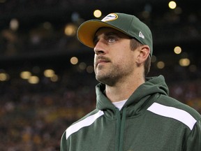 Aaron Rodgers of the Green Bay Packers returns to the field after a collarbone injury which occurred in the first half of a game against the Chicago Bears at Lambeau Field on November 04, 2013 in Green Bay, Wisconsin. (Mike McGinnis/Getty Images/AFP)