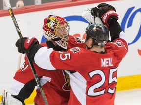Craig Anderson and Chris Neil celebrate the Senators' 5-0 win over the Penguins Monday night,