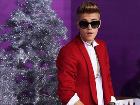 Singer Justin Bieber poses at the premiere of the documentary "Justin Bieber's Believe" in Los Angeles, California December 18, 2013. The documentary opens in the U.S. on December 25.  (REUTERS/Mario Anzuoni)