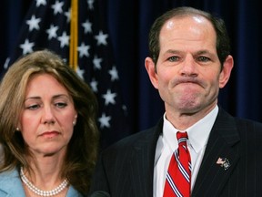 New York Governor Eliot Spitzer addresses the media with his wife Silda Wall Spitzer at his office in New York, in this March 10, 2008 file photo.  REUTERS/Shannon Stapleton/Files
