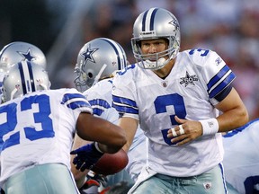 Dallas Cowboys quarterback John Kitna (R) hands the ball off to Tashard Choice (23) during the first quarter of the Cowboys AFC-NFC Hall of Fame Game against the Cincinnati Bengals in Canton, Ohio August 8, 2010. (REUTERS)