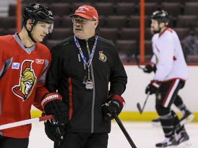 Paul MacLean with captain Jason Spezza.