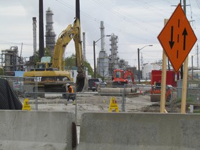 Work continues on the clean up at the site of a Sept. 10 pipeline rupture near the corner of Vidal Street and Churchill Road in Sarnia. A section of Churchill Road, from Vidal Street to Tashmoo Avnue, is expected to remain closed for at least another month.  PAUL MORDEN/ THE OBSERVER / QMI AGENCY