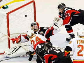 Belleville Bulls' Garrett Hooey (24) scores his first goal of the first period, out of his first OHL hat-trick, in OHL action against Niagara IceDogs at Yardmen Arena in Belleville, Ont. Saturday, Sept. 28, 2013. FILE/JEROME LESSARD/The Intelligencer/QMI Agency