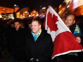 Canadian Foreign Minister John Baird visits the opposition camp at Independence Square in Kiev, Ukraine, on Dec. 5. The protests followed the Ukrainian government's U-turn away from Europe back towards Russia. (REUTERS)
