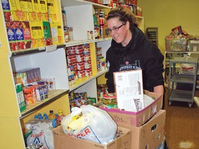 Stephanie Hadden moved to Vulcan early in October with her husband John Walsh, who is working on the Blackspring Ridge wind farm project near Carmangay. She has since become involved with the Vulcan County Food Bank, where she was helping to prepare Christmas hampers on Dec. 10.