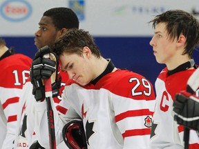 Canada's Jonathan Drouin (C) reacts with teammates goalie Malcolm Subban (L) and Ryan Nugent-Hopkins after their loss to USA in their semifinal game at the 2013 IIHF U20 World Junior Hockey Championship in Ufa January 3, 2013.  (REUTERS)