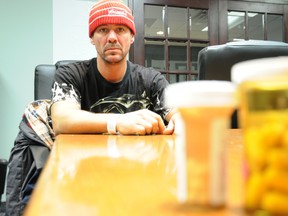 Marc Alarie stares at the bottles of pills he was prescribed after pricking his finger with a used needle at the Belle Pub. Alarie reported the incident to the local health unit prompting an inspector to visit the downtown bar. - W. BRICE MCVICAR The Intelligencer