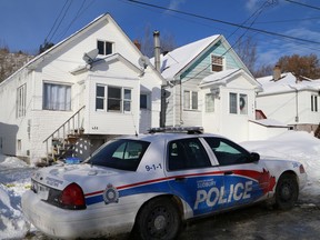 A Greater Sudbury Police cruiser is parked in front of 452 Dupont Street in Sudbury on Friday. A 43-year-old man, who lived at the residence, died following a fire at the building on Dec. 26. JOHN LAPPA/THE SUDBURY STAR/QMI AGENCY