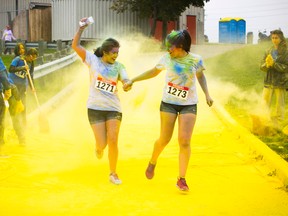 Participants in a Colours of Hope 5K run for the Canadian Cancer Society in Toronto earlier this year are showered with coloured powder as they pass a checkpoint. A similar "colour run" fundraiser for the Canadian Cancer Society is happening at Lambton College in Sarnia Jan. 11. (Submitted photo by Angela Lau)