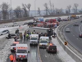 Police report no life-threatening injuries from a multiple-vehicle pileup that included a passenger bus that flipped on its side Saturday on Hwy. 401 near Brockville.