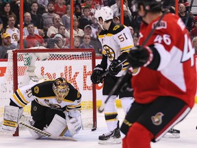 Ottawa Senators' Patrick Wiercioch watches his shot beat Boston Bruins' goaltender Tuukka Rask during NHL hockey action at the Canadian Tire Centre in Ottawa on Saturday December 28, 2013. 
Errol McGihon/Ottawa Sun/QMI Agency