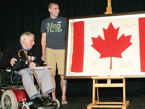 Syd Webster, Kingston Collegiate and Vocational Institute head boy, and John Matheson, co-designer of the Maple Leaf flag, took part in the unveiling of the Canadian flag at the school on Tuesday, June 14, 2011 that first flew over the school on Monday, Feb. 15, 1965, to coincide with the raising of Canada’s new flag on Parliament Hill. ROB MOOY /QMI AGENCY