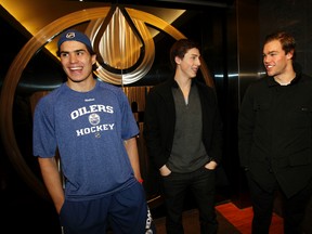Edmonton Oilers number 1 draft picks Nail Yakupov (l), Ryan Nugent-Hopkins (c), and Taylor Hall chat after a conditioning skate at Rexall Place in Edmonton Alta., on Friday Jan. 11, 2013. Nugent-Hopkins had just arrived at the rink from the airport and this was the first time the three number one overall  NHL draft picks were in  the same building together.Perry Mah/Edmonton Sun/