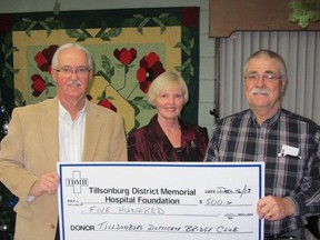 The Tillsonburg Duplicate Bridge Club made a series of Christmas donations this year. In this photo, Tillsonburg District Memorial  Hospital Foundation representative Dave Corner (left) accepts a $500 donation from bridge club members Diana May and Bill Misener. Contributed Photo