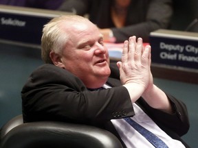 Mayor Rob Ford motions after winning a vote at a December council meeting. (MICHAEL PEAKE, Toronto Sun)