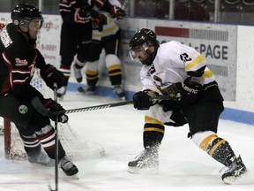 Chris McGuffin (right) is cut off on a wraparound attempt Friday evening at the Kinsmen/Memorial Arena. McGuffin would stick with the play, setting up the game-winner with 6:20 remaining in regulation time. Jeff Tribe/Tillsonburg News