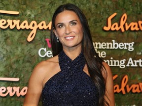 Demi Moore has sparked speculation she is enjoying a new romance after she was snapped cuddling a mystery man during a festive vacation.

REUTERS/Fred Prouser