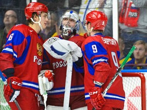 Russia's Nikita Zadorov (left), Anton Slepyshev and goalkeeper Andrei Vasilevski react after losing to Sweden in the world junior championship at Malmo Arena December 31, 2013.(REUTERS/Ludvig Thunman/TT News Agency)