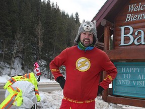 Jamie McDonald, of Gloucester, England, stands in front of the Welcome to Banff sign as he enters the community on New Year's Eve. McDonald is running across Canada to raise funds for sick children in the United Kingdom and Canada. He was mugged and beaten up during the early hours of New Year's Day. Dave Husdal /QMI Agency