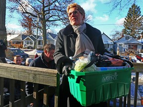 Premier Kathleen Wynne handed out food hampers on a Toronto street earlier this week. (DAVE ABEL, Toronto Sun)