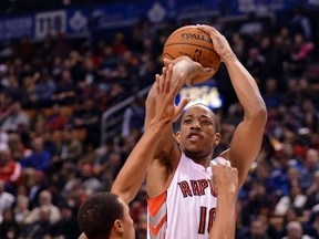 Raptors guard DeMar DeRozan takes a jump shot over Indiana Pacers point guard George Hill at the ACC Jan. 1. (USA TODAY)