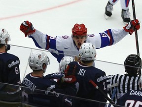 Russia's Pavel Buchnevich celebrates after scoring the winning goal in front of U.S. players in their IIHF Ice Hockey World Championship quarter-final match in Malmo January 2, 2014. (REUTERS)