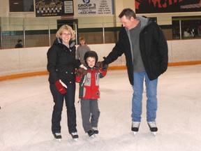 Linda Ryerse, left, took advantage of free public skating New Year's Eve at West Elgin Arena with Markus Fuller and Bart Sherman, right.