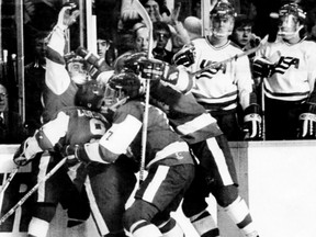 Team Canada celebrates a goal against Team USA at the 1986 World Junior Championship in Hamilton, Ont. Oil Kings head coach Derek Laxdal was part of the Canadian squad. (Reuters)