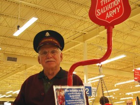 Salvation Army volunteer Bob Barrett stands with a Christmas kettle at the Real Canadian Superstore in St. Thomas prior to Christmas.