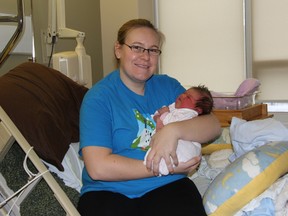 Alida Kroesbergen, of Ailsa Craig, holds her new daughter Emily on Jan. 2. The youngster was delivered at 5:44 a.m. on Jan. 1, marking the first New Year’s Day baby at Strathroy Middlesex General Hospital since 2011.
JACOB ROBINSON/AGE DISPATCH/QMI AGENCY