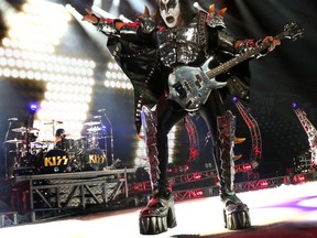 KISS bassist Gene Simmons performs in Calgary, Alta. on Friday November 8, 2013 at the Scotiabank Saddledome. (Jim Wells/QMI Agency)