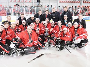 Steve Arsenault and his fellow countrymen after defeating the U.S. at the World Sledge Hockey Challenge in Toronto. - Photo Supplied