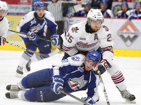 Sudbury Wolves player Nathan Pancel fights for the puck against Colin Suellentrop of the Oshawa Generals during second-period OHL action at Sudbury Community Arena last season. GINO DONATO/THE SUDBURY STAR