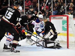 Deavid Perron follows the puck to the net against Ducks goaltender Jonas Hiller during first-period action Friday at Anaheim's Honda Center. (USA TODAY)