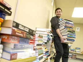 Textbooks line the walls of Textbooks for Change founder Chris Janssen’s office at the Goodwill building on White Oaks Rd. in London Ont. The books, donated by schools and students, are collected, sorted, and then donated to African universities.