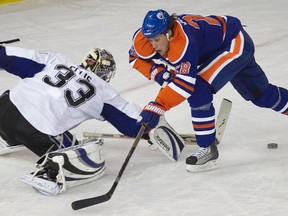 Edmonton's Ryan Jones can't get the puck past Tampa Bay's Dan Ellis during a breakaway during the Edmonton Oilers game against the Tampa Bay Lightning at Rexall Place in Edmonton on Friday, December 10, 2010. CODIE MCLACHLAN/EDMONTON SUN/QMI AGENCY