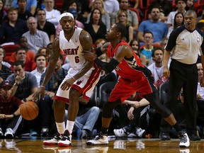 LeBron James of the Miami Heat posts up Terrence Ross of the Toronto Raptors during a game in Miami on Sunday night. (Mike Ehrmann/Getty Images/AFP)