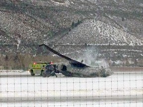 The wreckage of a private jet lies on the runway after it crashed and burned as it landed at Aspen/Pitkin County Airport in Colorado January 5, 2014.  One person died and two were injured in the crash, the Pitkin County Sheriff office said.  REUTERS/C Morris Singer