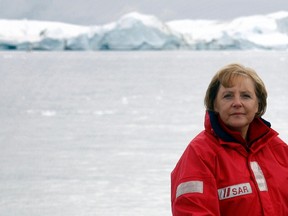 File photo of German Chancellor Angela Merkel standing aboard a ship during a visit to a fjord near Ilulissat in Greenland on August 16, 2007. (REUTERS/Michael Kappeler/Pool/Files)