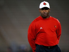 Head coach Charlie Strong of the Louisville Cardinals watches his team warm up prior to the game against the Connecticut Huskies at Rentschler Field on November 8, 2013 in East Hartford, Connecticut. (Jared Wickerham/Getty Images/AFP)
