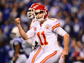 Kansas City Chiefs quarterback Alex Smith (11) celebrates after throwing a pass for a touchdown during the second quarter of the 2013 AFC wild card playoff football game against the Indianapolis Colts at Lucas Oil Stadium. (Andrew Weber-USA TODAY Sports)