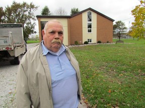 Lonny Napper, mayor of Plympton-Wyoming, is shown standing outside the Camlachie Library in this file photo from October 2011. The library building committee that organized the conversion of the former church to a library branch has been named to this year's mayor's community appreciation awards. The 14 recipients of this year's award will be honoured Feb. 1 in Camlachie. PAUL MORDEN/THE OBSERVER/QMI AGENCY